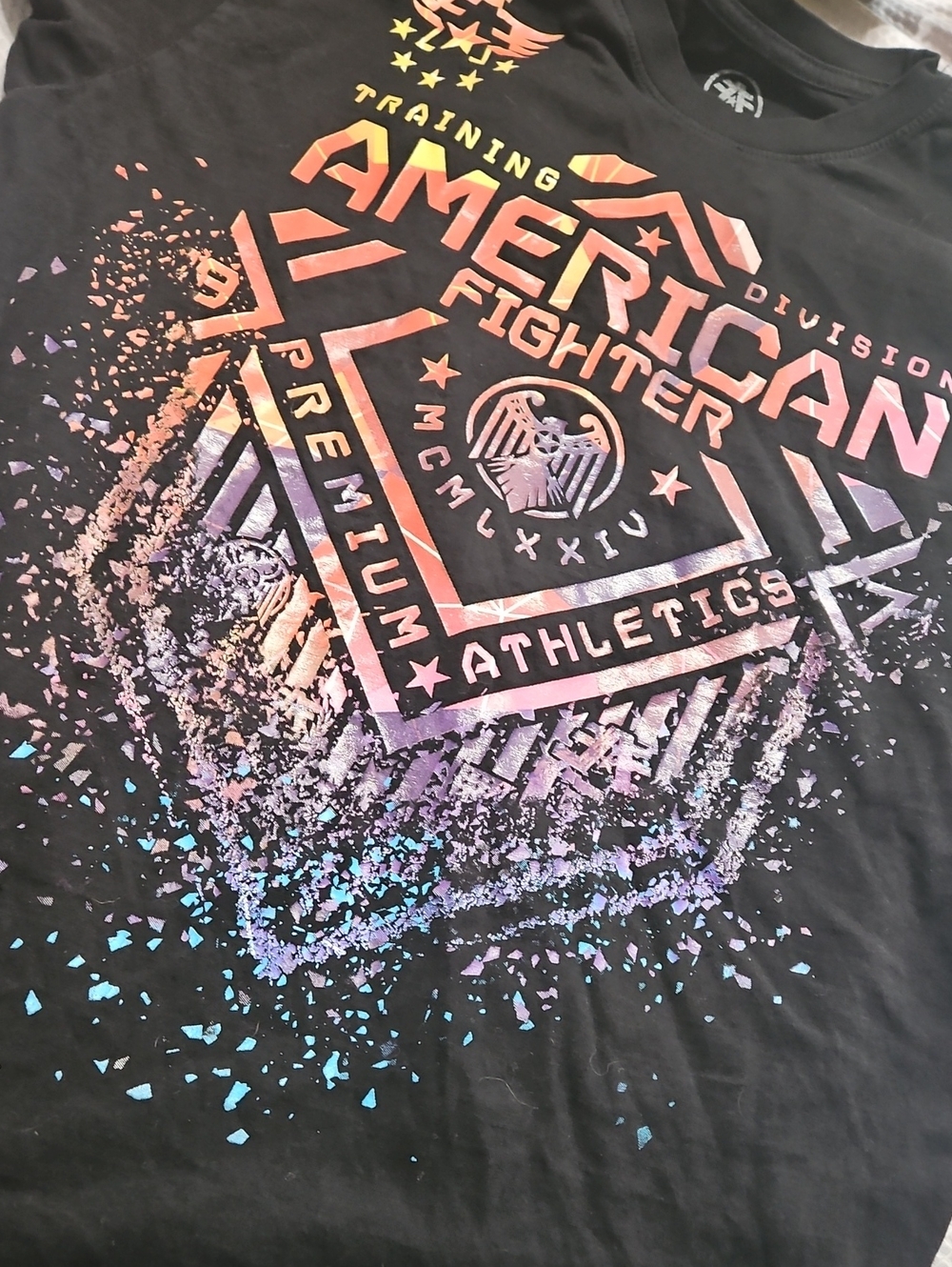 American Fighter Black Tee with Iridescent Pink-Purple-Blue Print EUC